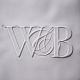 Raised Embossed WB Logo